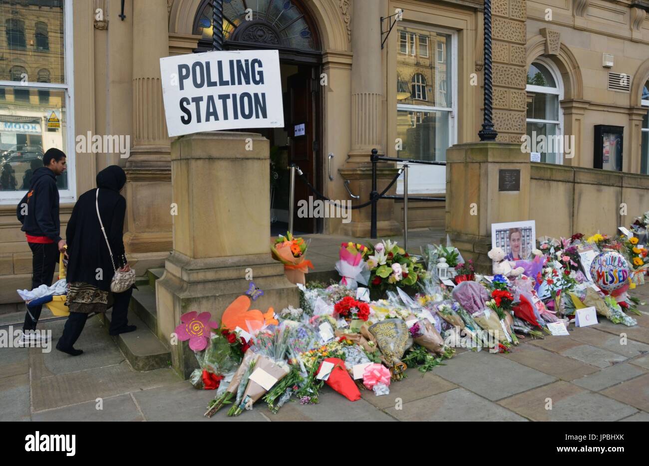 Flowers line the entrance of a polling station in Batley, northern ...