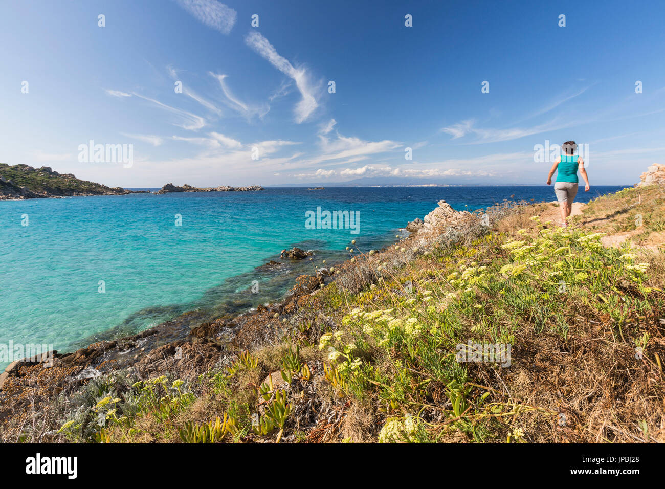 A walk on the path overlooking the turquoise sea Santa Teresa di Gallura Province of Sassari Sardinia Italy Europe Stock Photo
