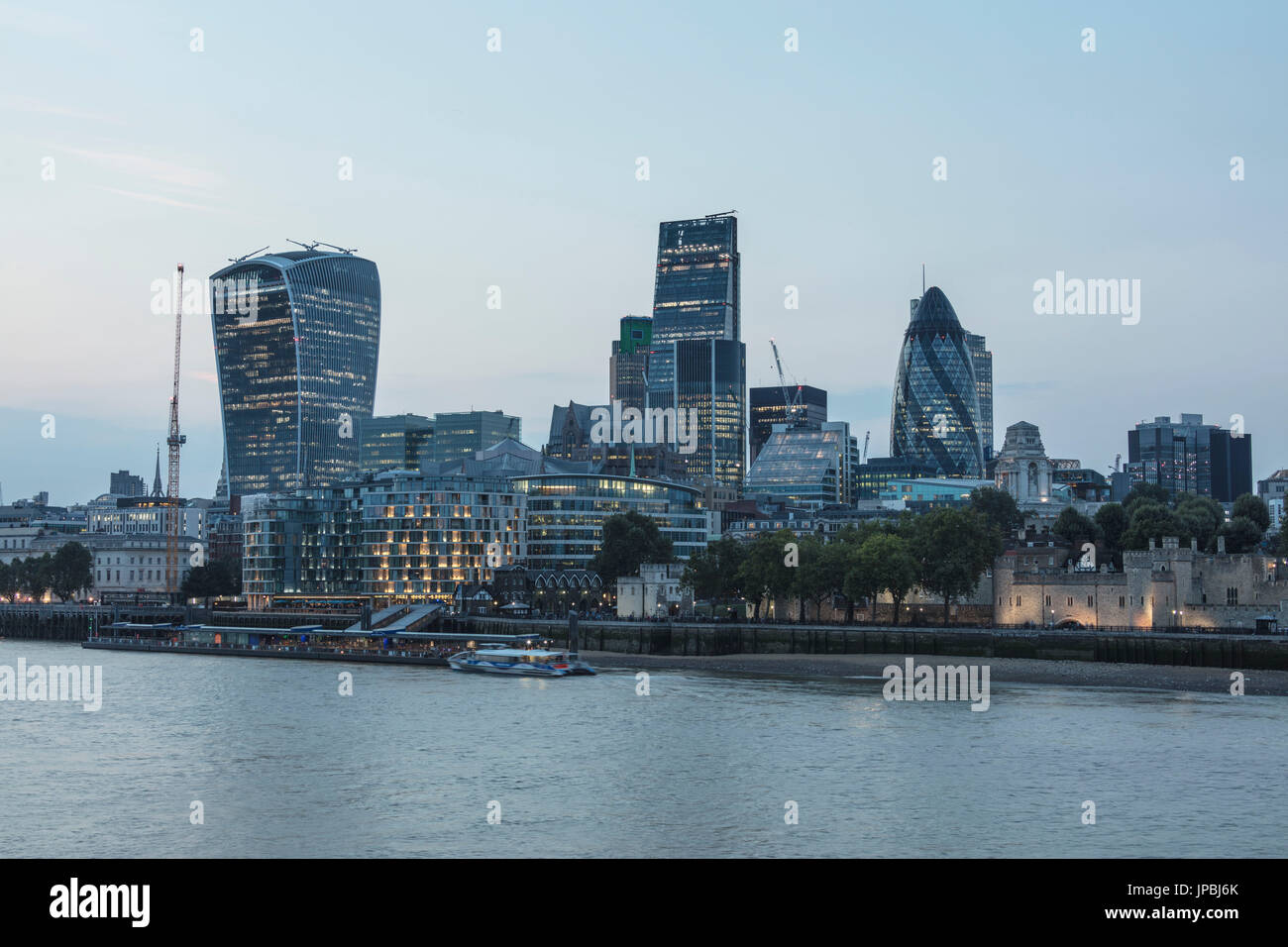 Night view of river Thames with the skyscrapers of the city in the background London United Kingdom Stock Photo