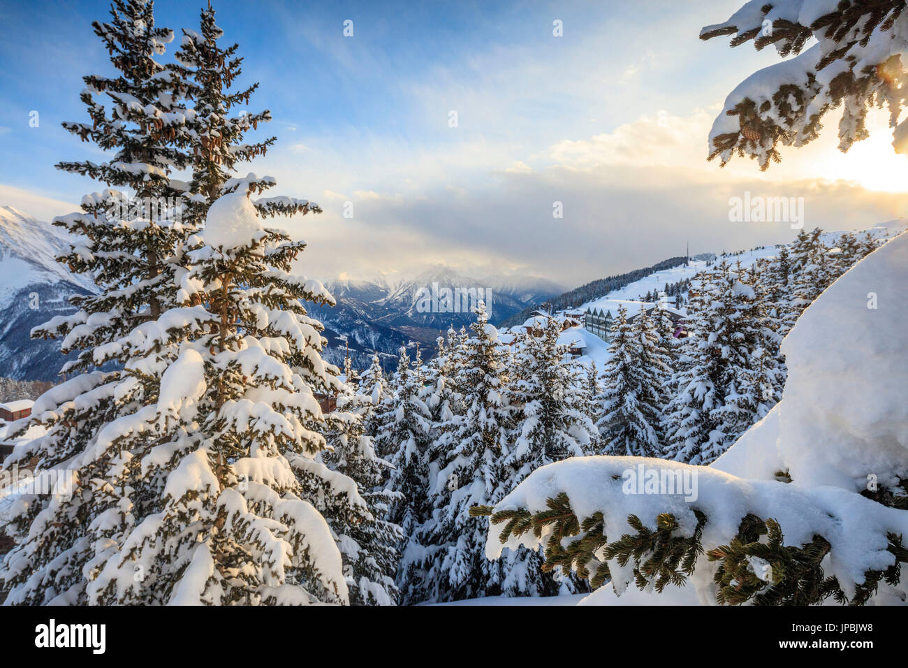 Snowy woods and trees framed by the winter sunset Bettmeralp district of Raron canton of Valais Switzerland Europe Stock Photo