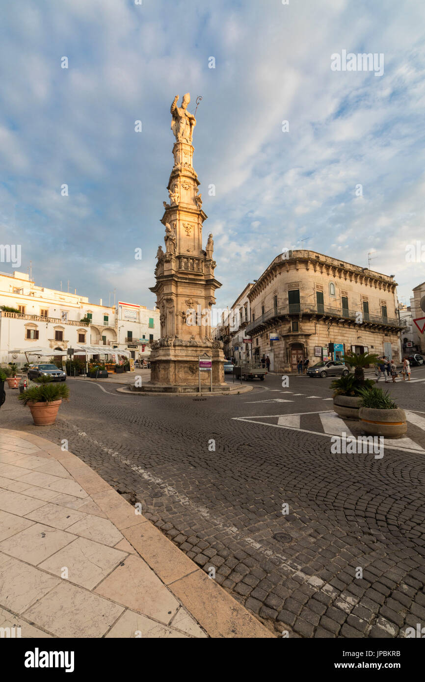 Historical buildings and statues in the medieval city center of Ostuni province of Brindisi Apulia Italy Europe Stock Photo