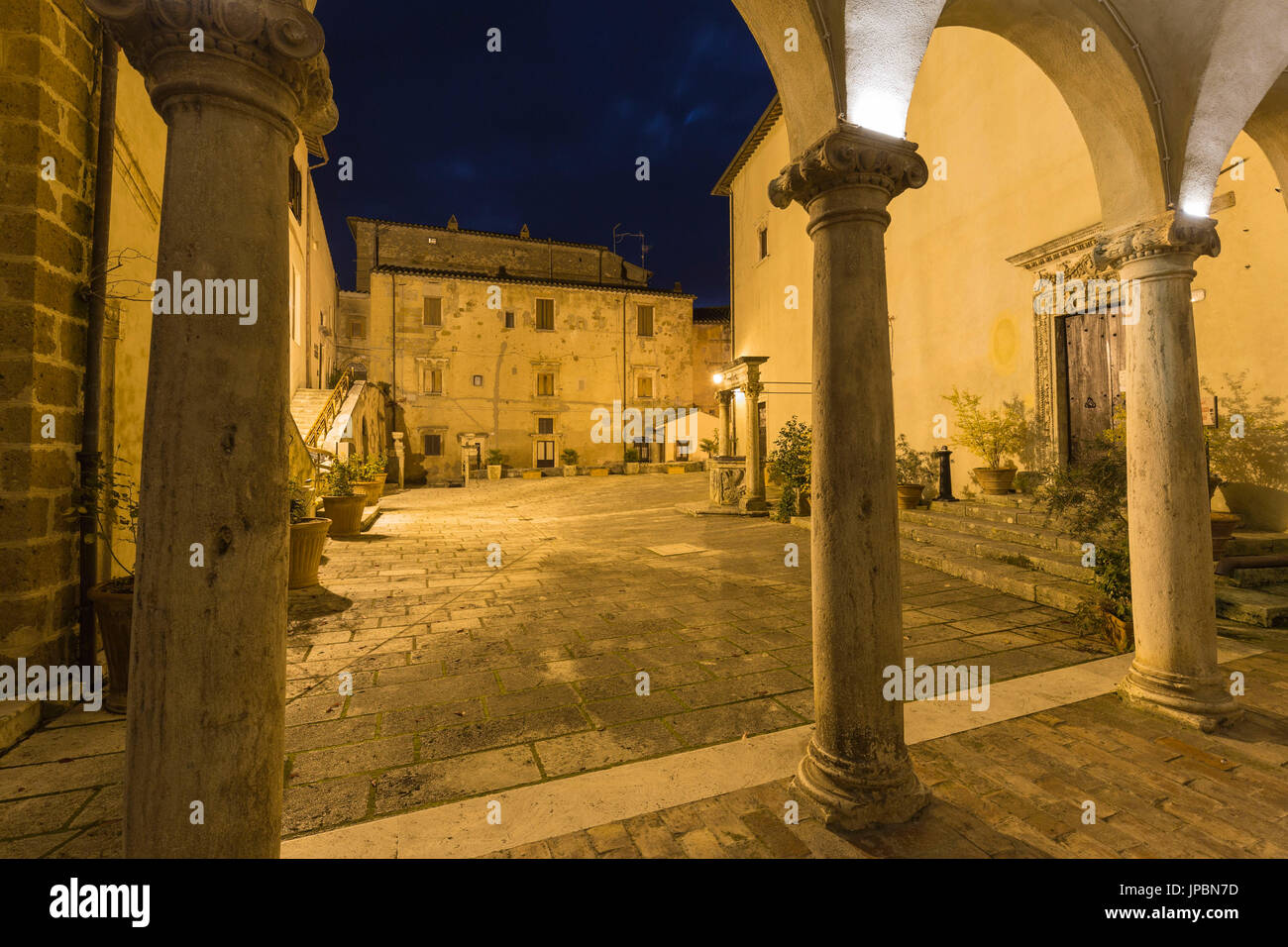 Lights on Orsini Palace Square at night. Pitigliano, Grosseto province, Tuscany, Italy, Europe Stock Photo