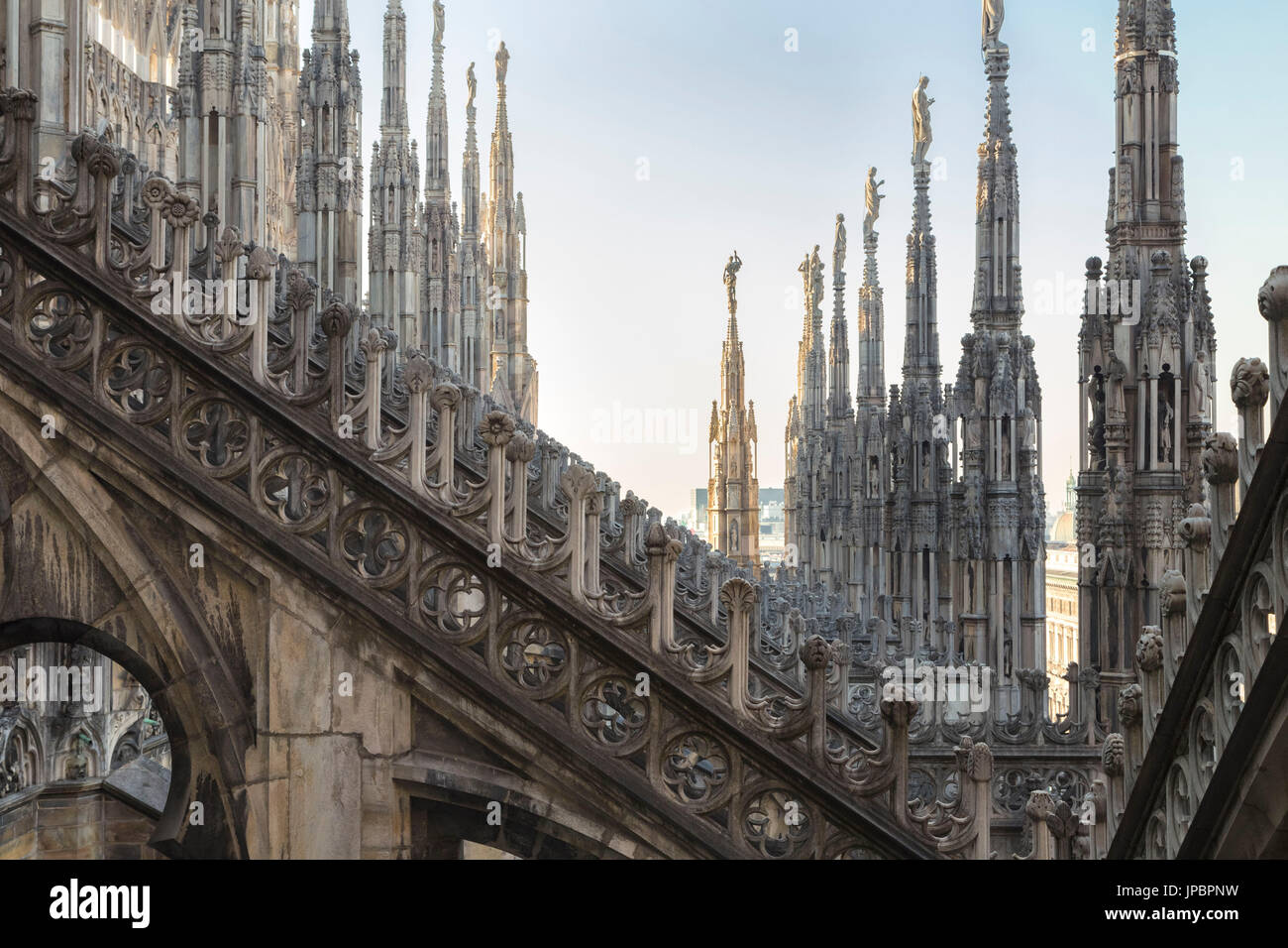 On the rooftop of the Duomo di Milano, among the white marble spiers, Milano, Lombardy, Italy. Stock Photo