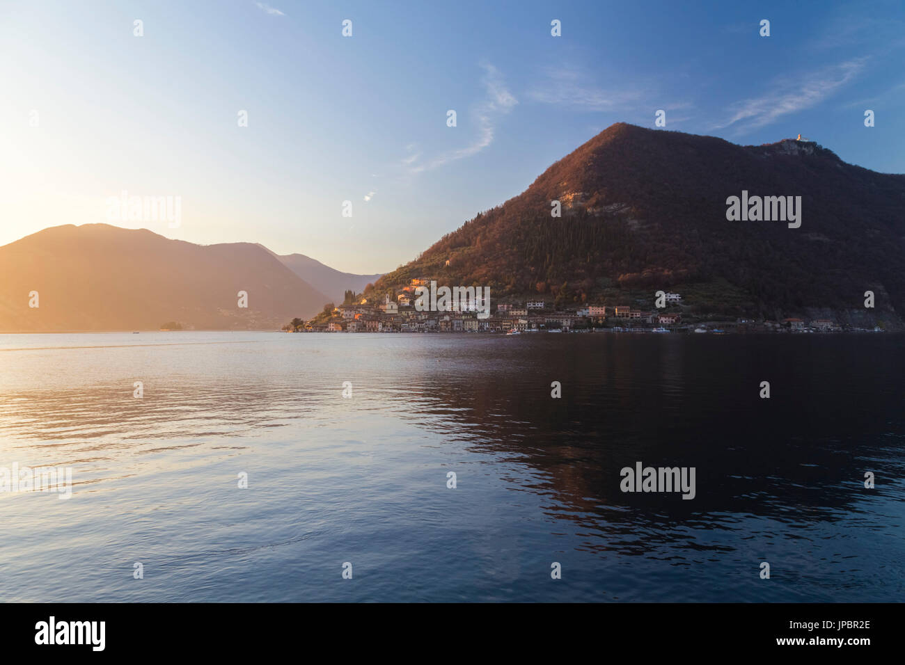 Monte Isola reflection on Lake Iseo during a winter sunset, Brescia Province, Iseo Lake, Lombardy, Italy. Stock Photo