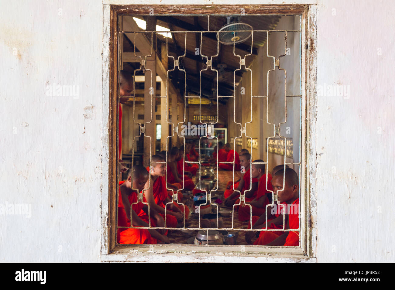 Tra Vinh, Mekong Delta, Southern Vietnam. Khmer Krom monks eating in the pagoda. Stock Photo