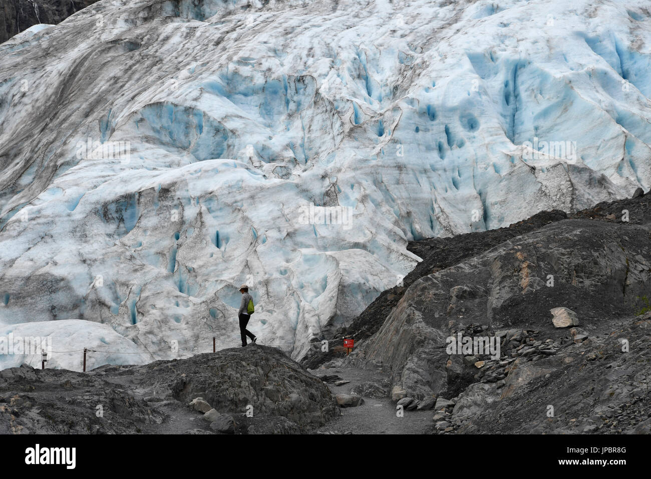 Person close to exit glacier, Alaska,USA Stock Photo