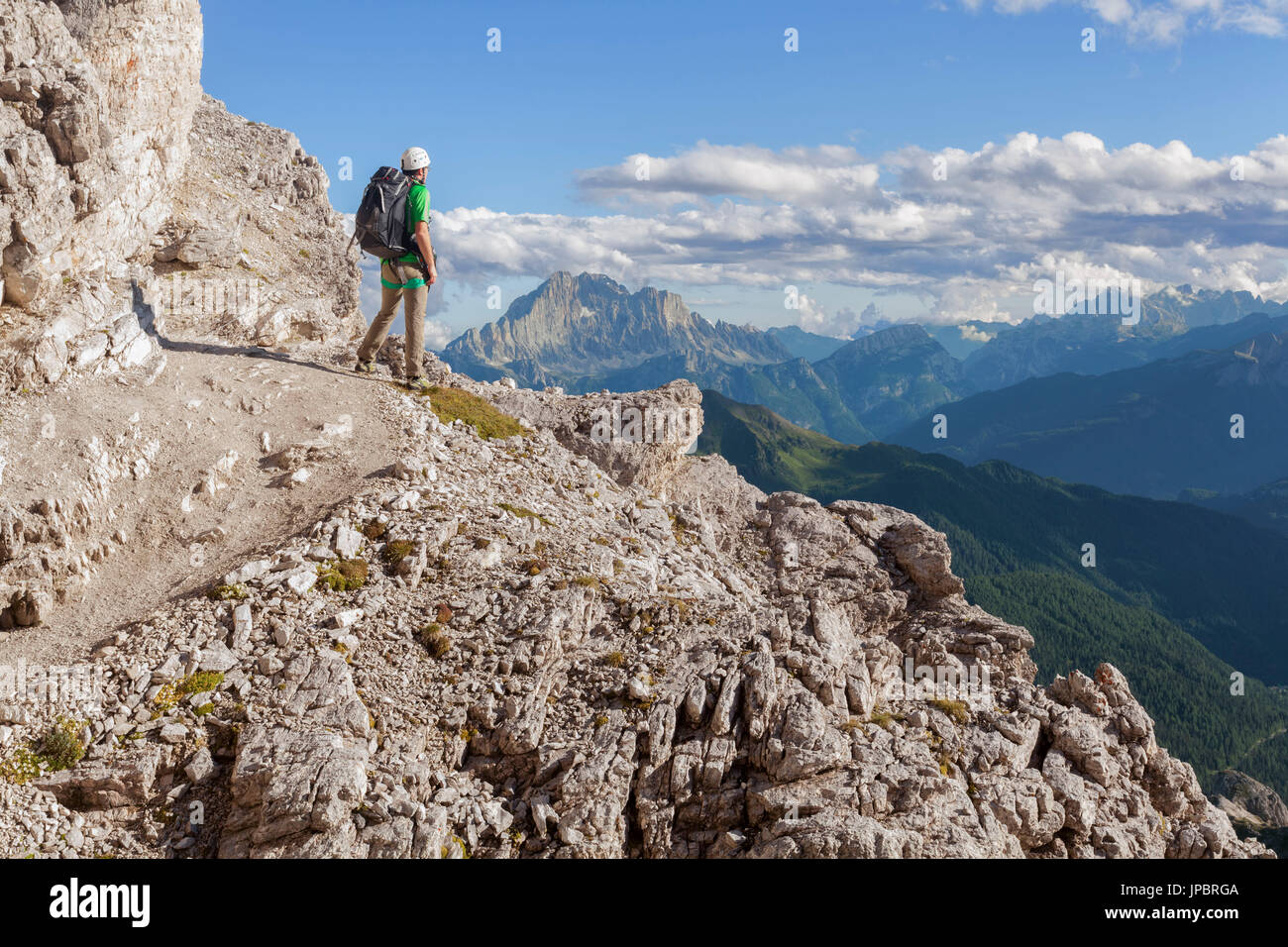 Europe, Italy, Veneto, Belluno. Hiker along the trail Kaiserjaeger, Piccolo Lagazuoi, Dolomites Stock Photo