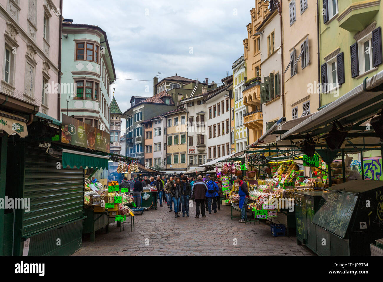 People at the city center fruit and vegetables market. Obstmarkt Square, Bolzano, Trentino Alto Adige - Sudtirol, Italy, Europe. Stock Photo