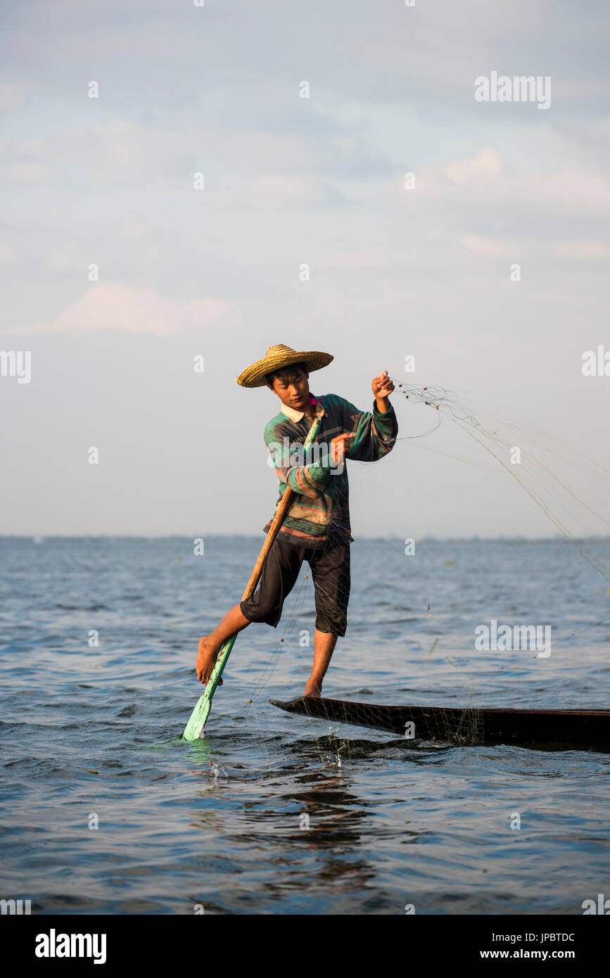 Inle lake, Nyaungshwe township, Taunggyi district, Myanmar (Burma). Local fisherman on the edge of the boat. Stock Photo