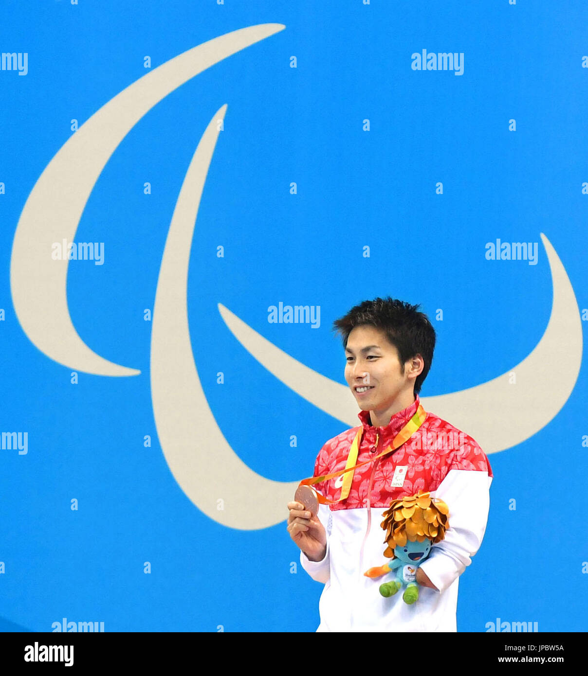 japan-s-takuro-yamada-holds-the-bronze-medal-he-won-in-the-men-s-50