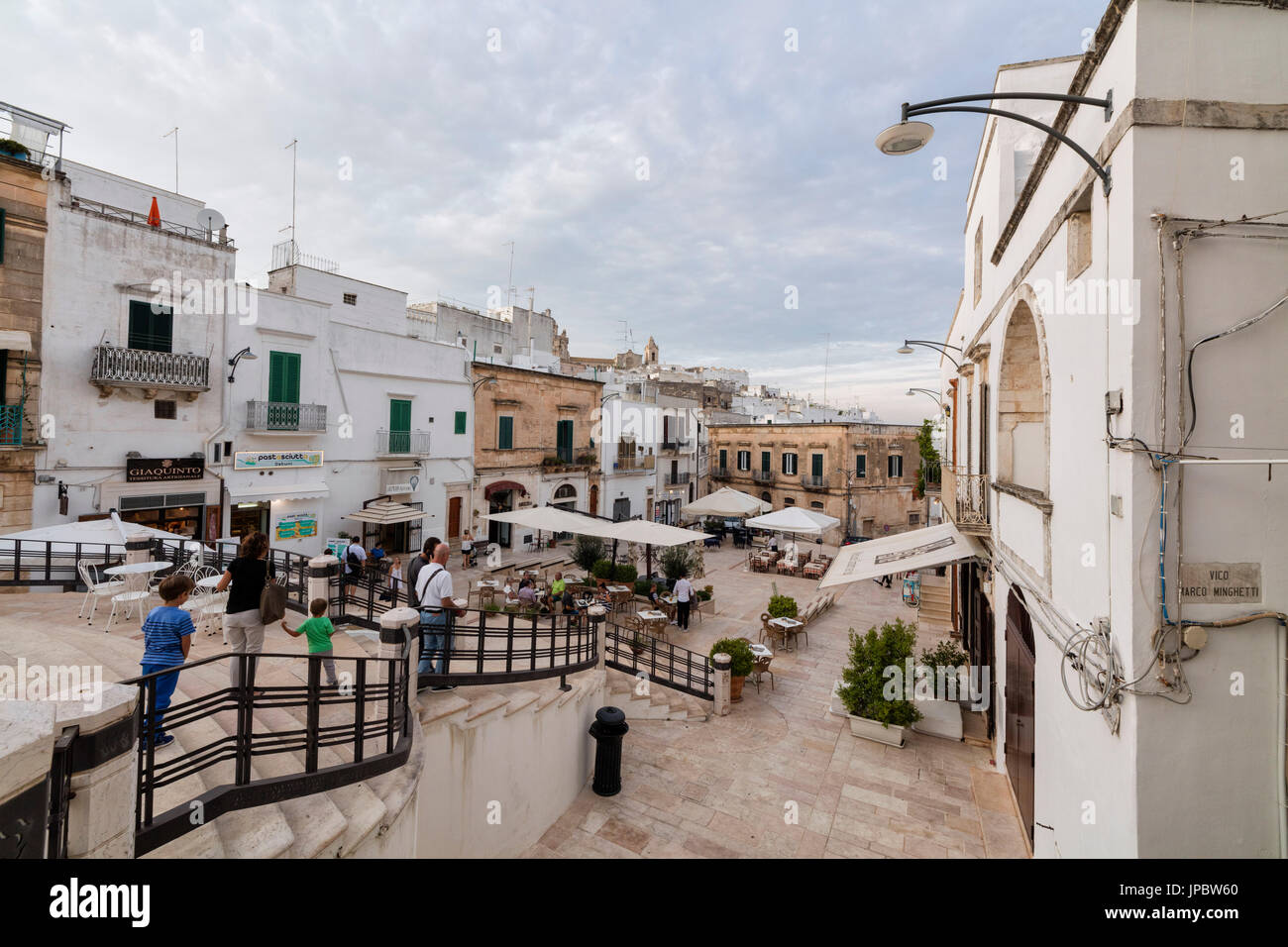 Tourists in the main sqaure of the old medieval town Ostuni province of Brindisi Apulia Italy Europe Stock Photo