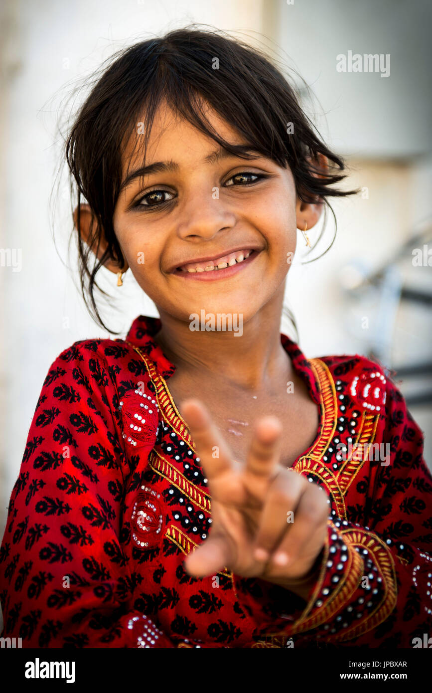 Sinaw, Sultanate of Oman, Middle East. Little girl with traditional dress. Stock Photo