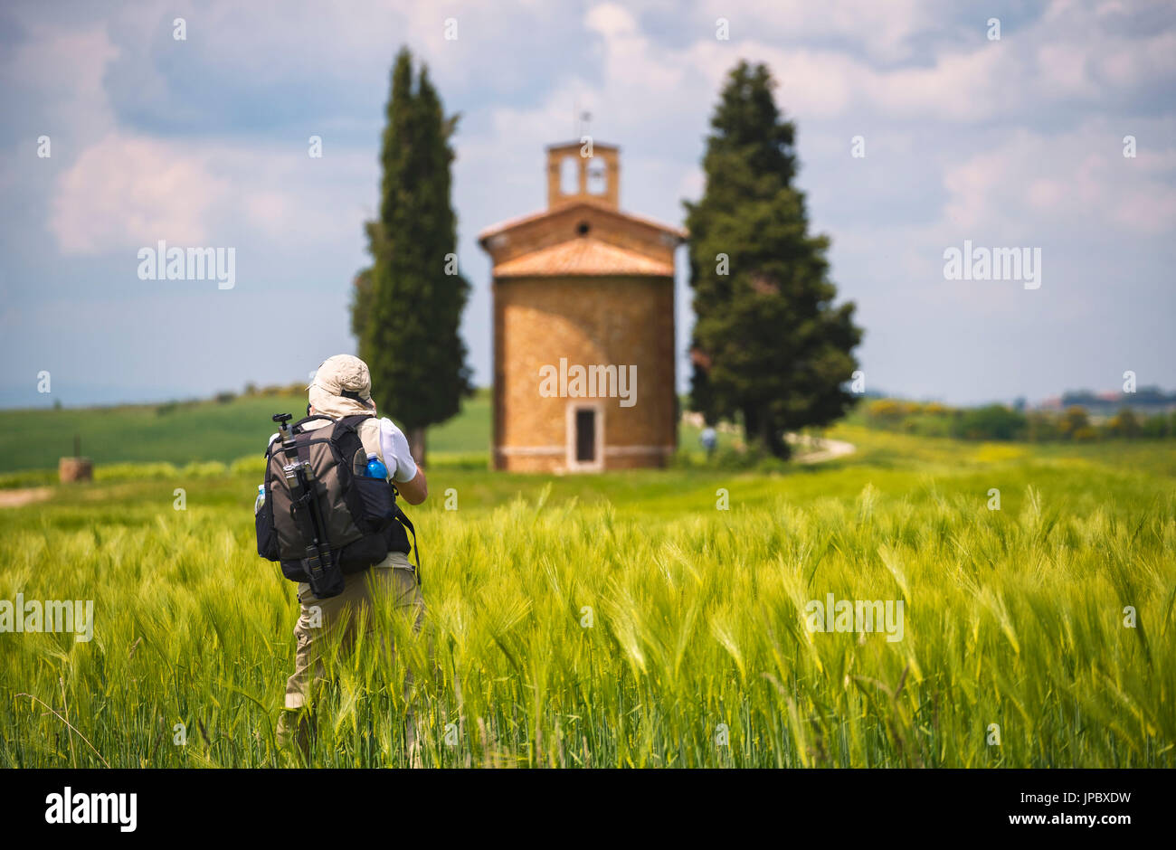 Europe, Italy photographer at the chapel Vitaleta, province of Siena, Tuscany. Stock Photo