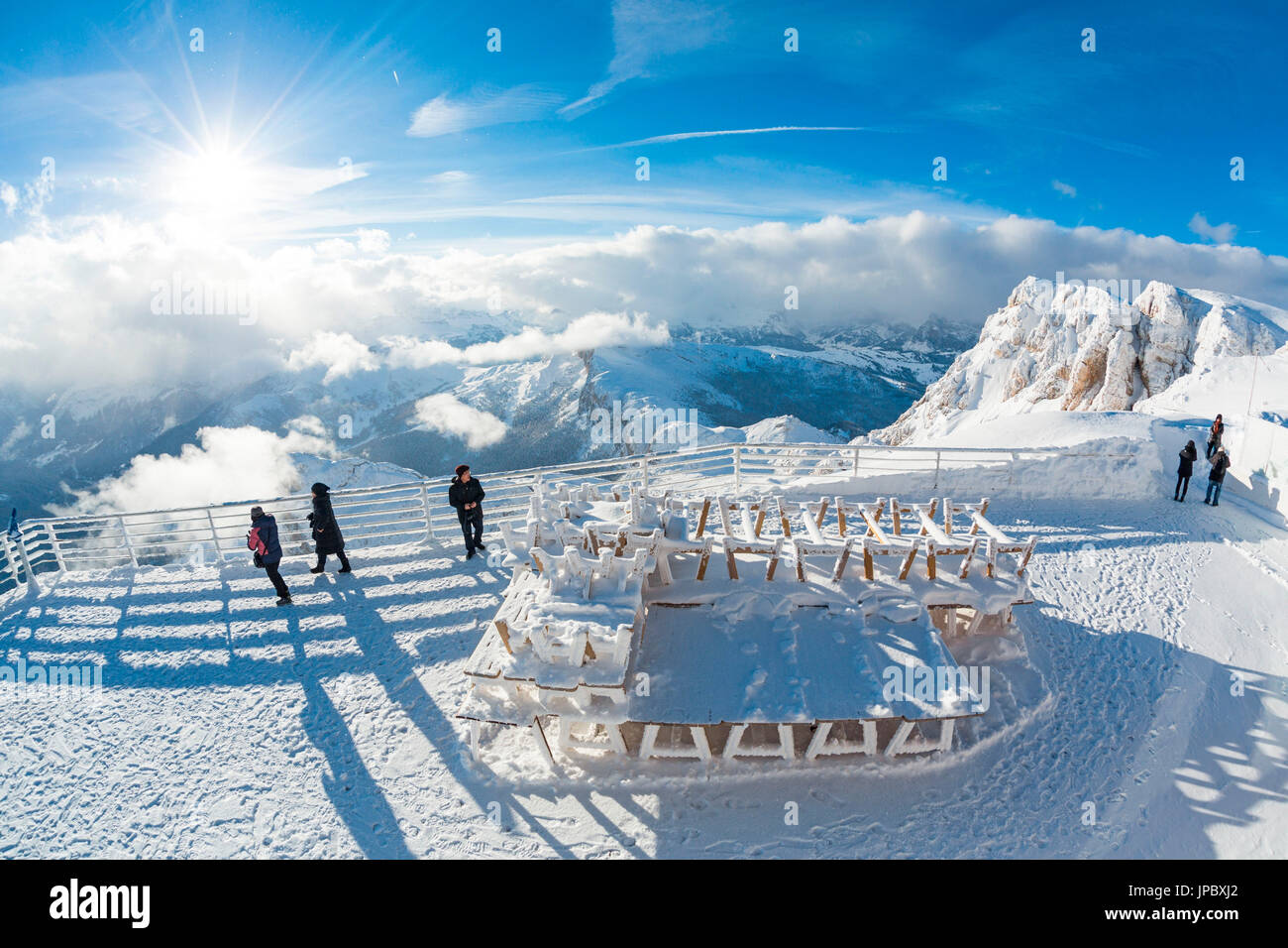 Sun and clouds on the snowy peaks of Dolomites seen from the terrace of the Rifugio Lagazuoi Cortina D'Ampezzo Belluno Veneto Italy Europe Stock Photo