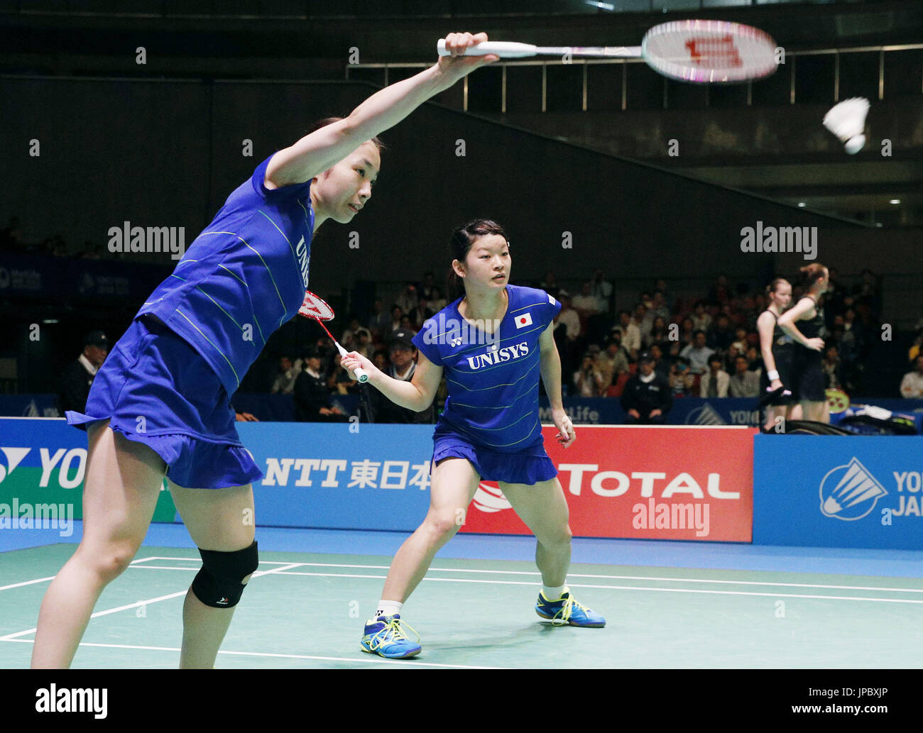 Rio Olympic women's doubles badminton champions Ayaka Takahashi (R) and