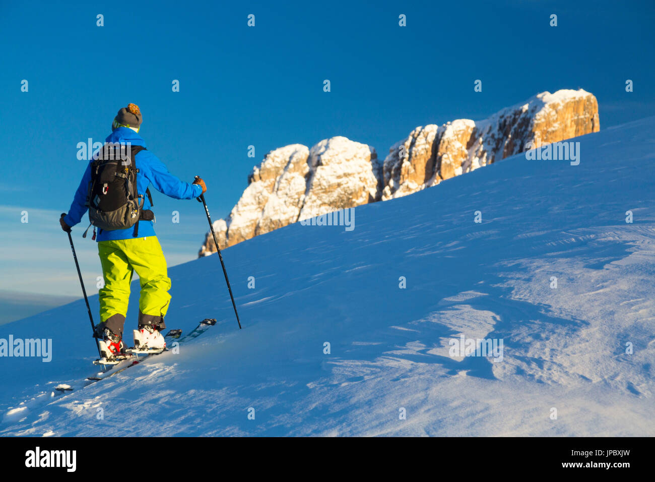 Ski touring on Croda Negra, on the background Averau peak. Passo Falzarego, Veneto, Italy. Stock Photo
