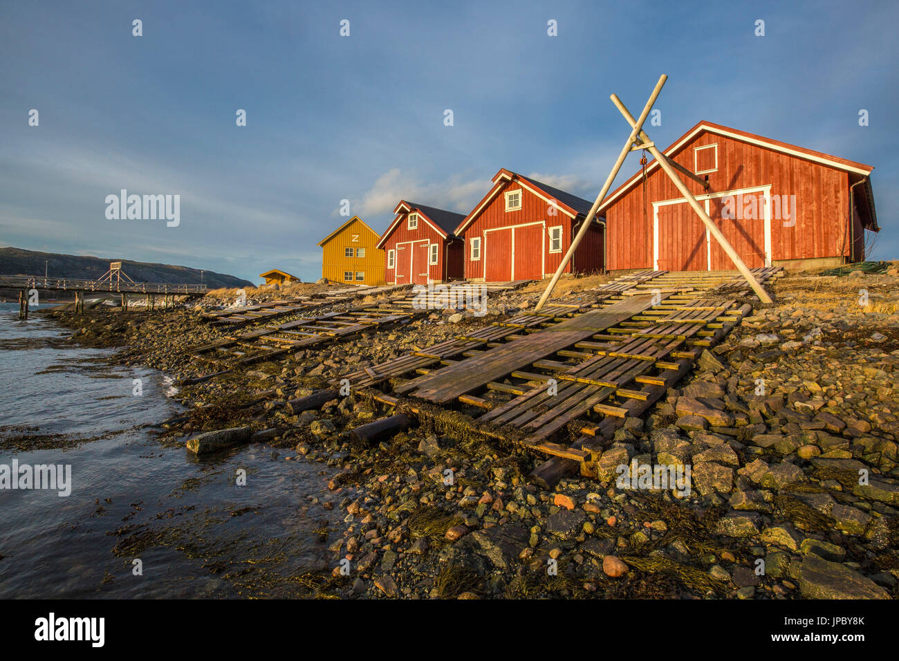 The colors of dawn light up the houses of fishermen Flatanger Trøndelag Norway Europe Stock Photo