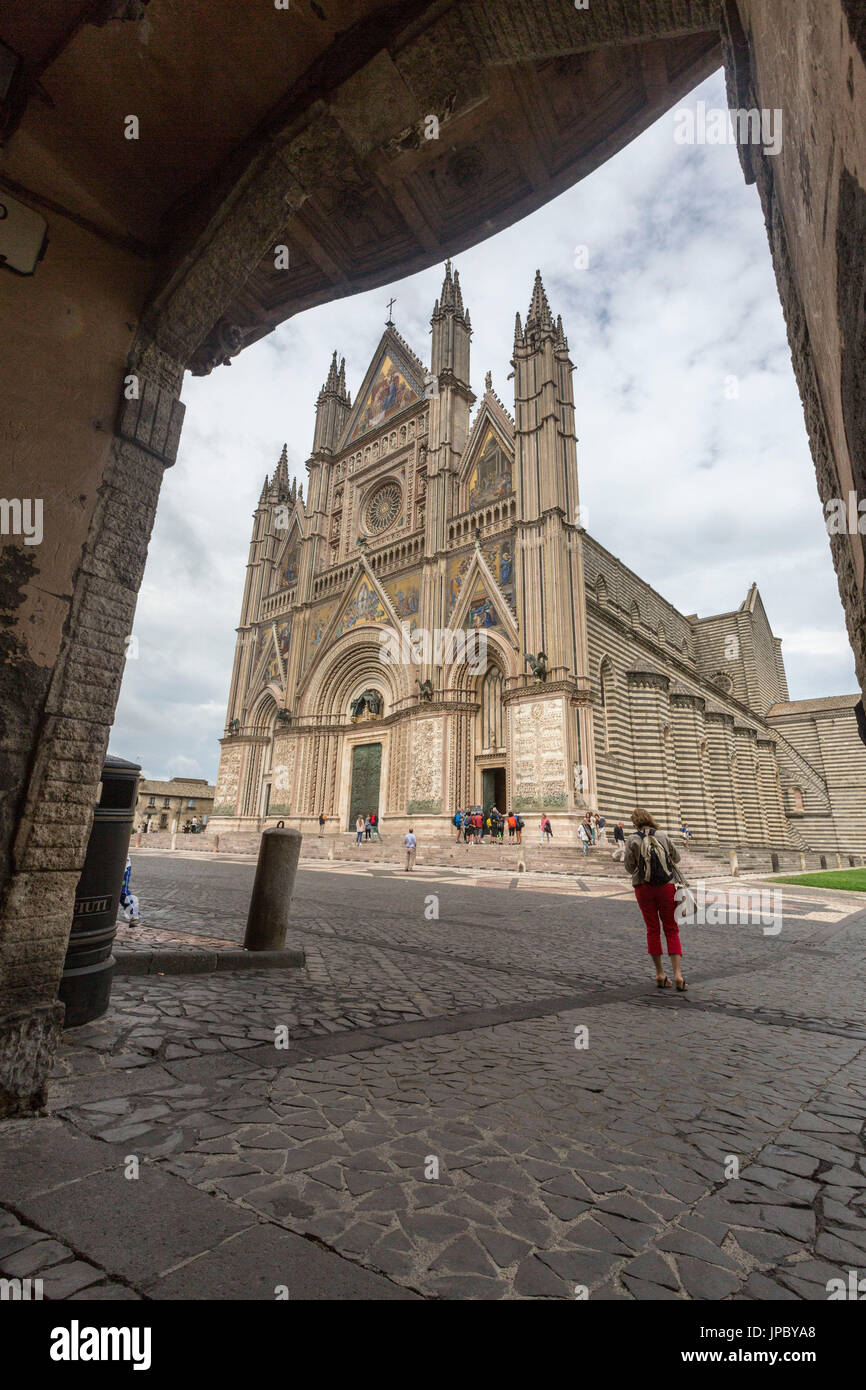 View of the gothic cathedral with golden mosaics and bronze doors Orvieto Terni Province Umbria Italy Europe Stock Photo