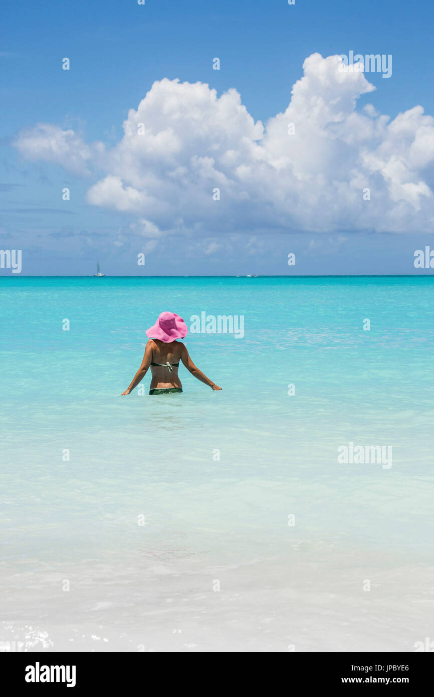 Bather in the turquoise waters of the Caribbean Sea Jolly Beach Antigua and Barbuda Leeward Island West Indies Stock Photo