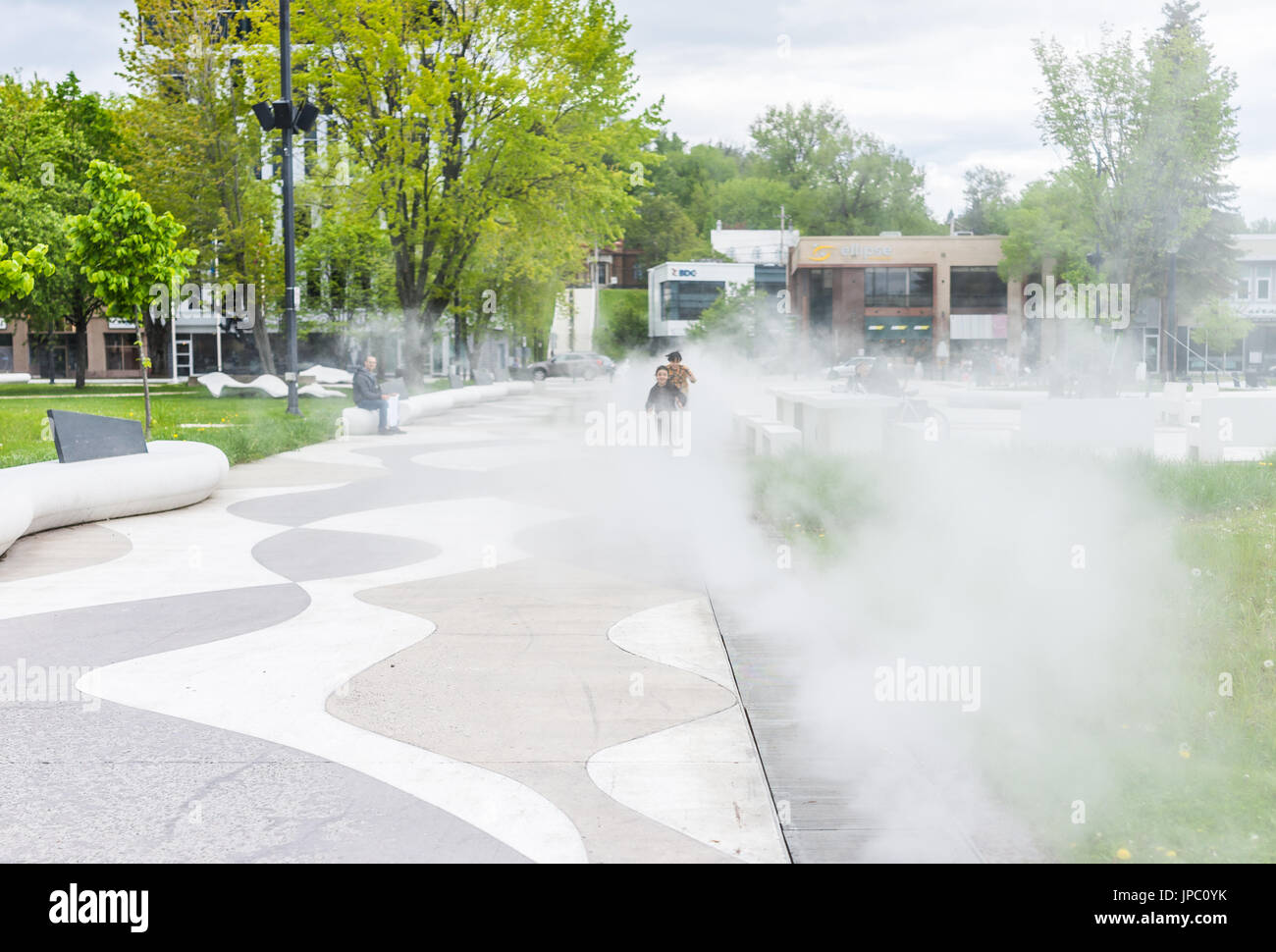 Saguenay, Canada June 3, 2017 Kids running in mist fog steam water