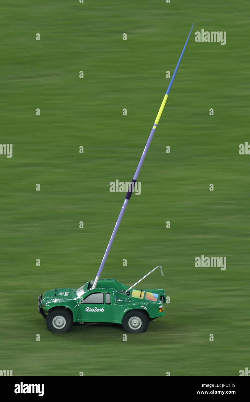 A small radiocontrolled car returns a javelin thrown in the field
