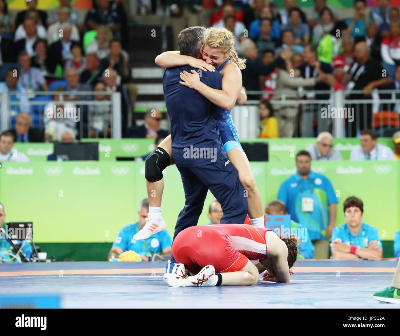 Helen Louise Maroulis (back) of the United States celebrates with her