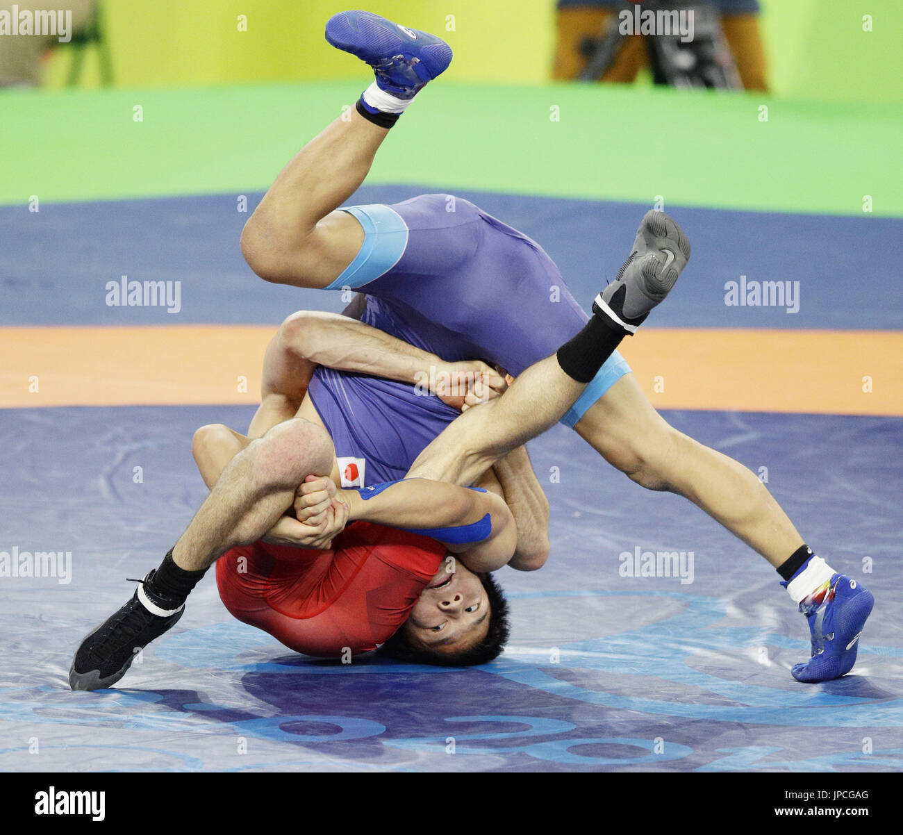 Rei Higuchi (facing camera) of Japan fights with Vladimer