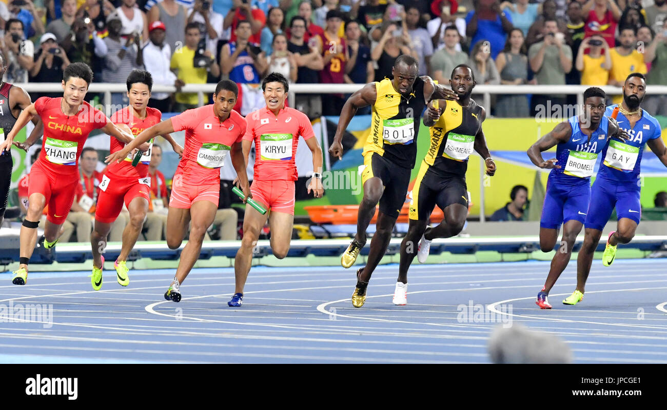 Usain Bolt (4th from R) runs the anchor leg of the men