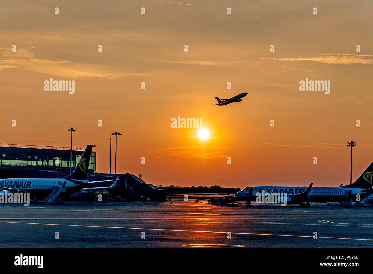 London Stansted Airport aircraft taking off at sunset. Stock Photo