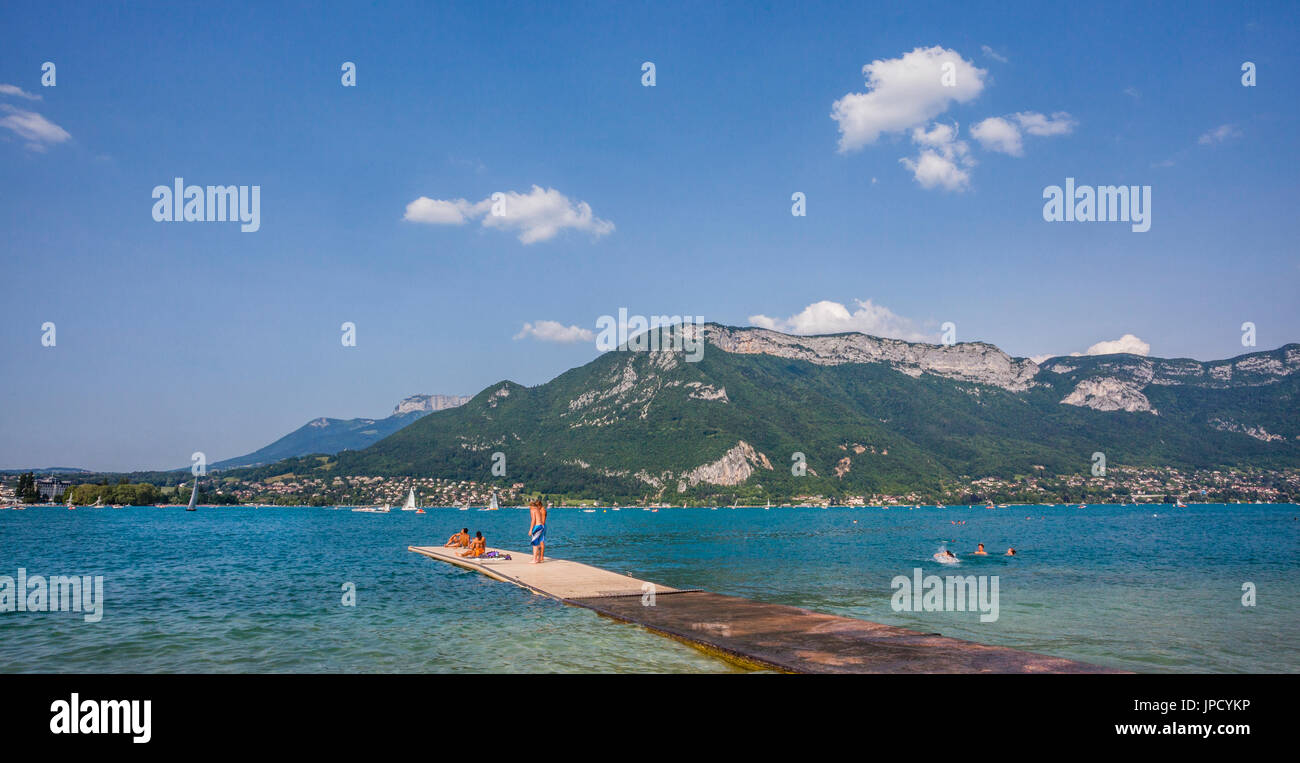 France, Annecy, sun seekers on the shores of Lake Annecy at Marquisats Nautical Base enjoy a sunny summer day Stock Photo