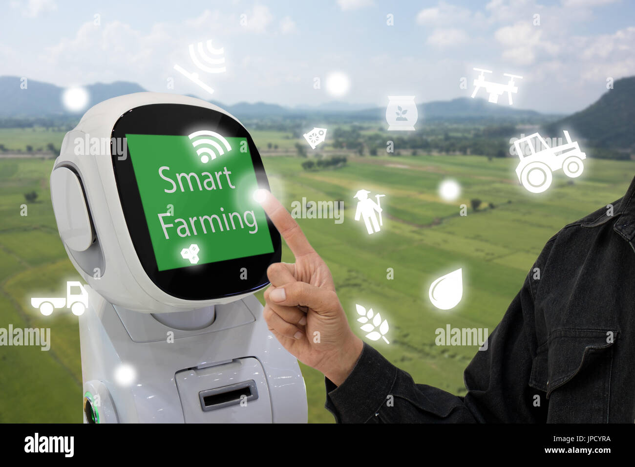 iot, internet of things, agriculture concept, Farmer use smart robot to help to control monitor and management including feed water, fertilizer, chemi Stock Photo