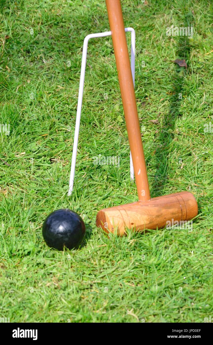 Croquet Mallet and black ball Stock Photo