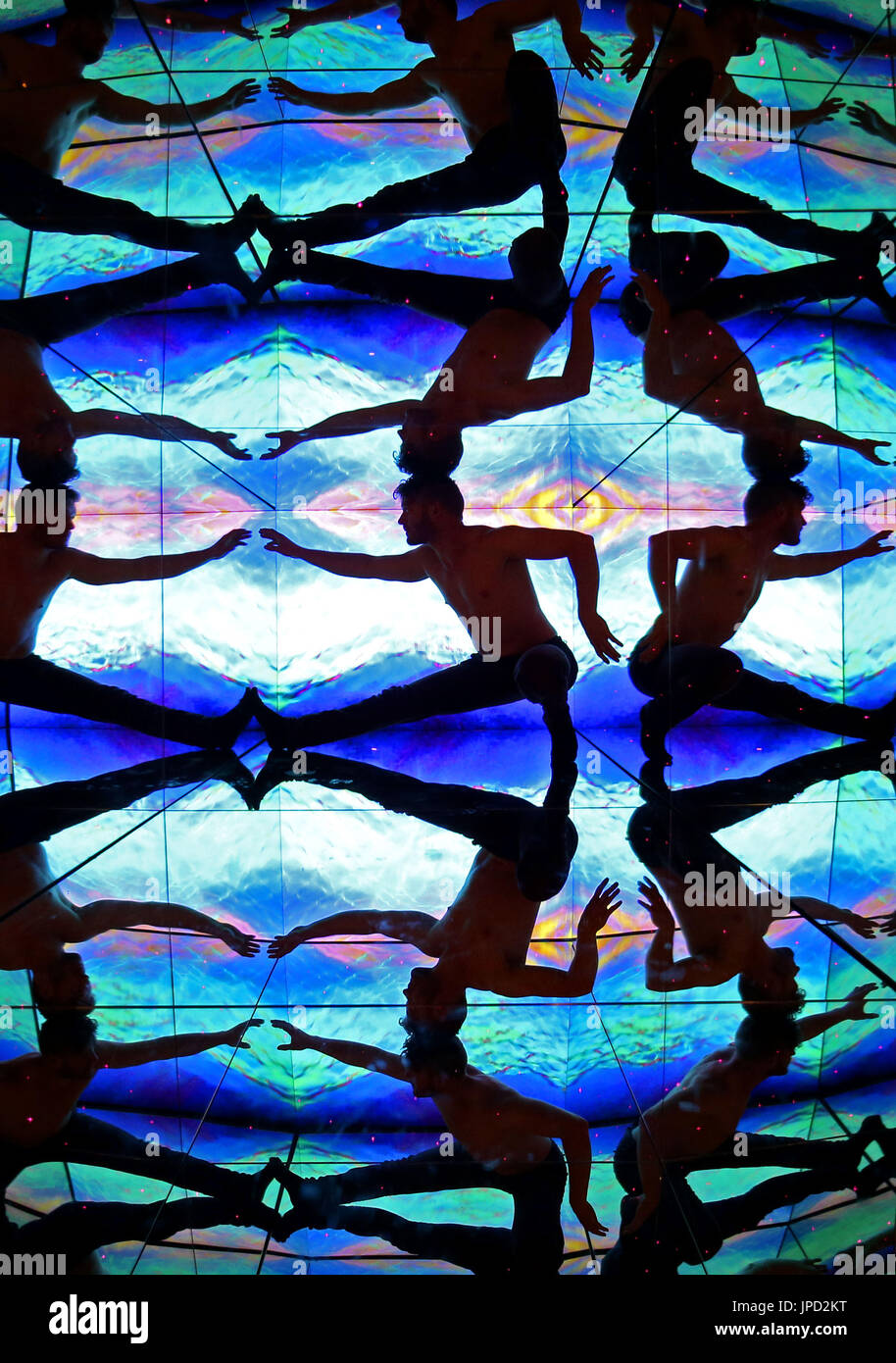 A member of Head First Acrobats performs inside the giant kaleidoscope at Camera Obscura and World of Illusions, Edinburgh, ahead of their Fringe Festival show Elixir. Stock Photo