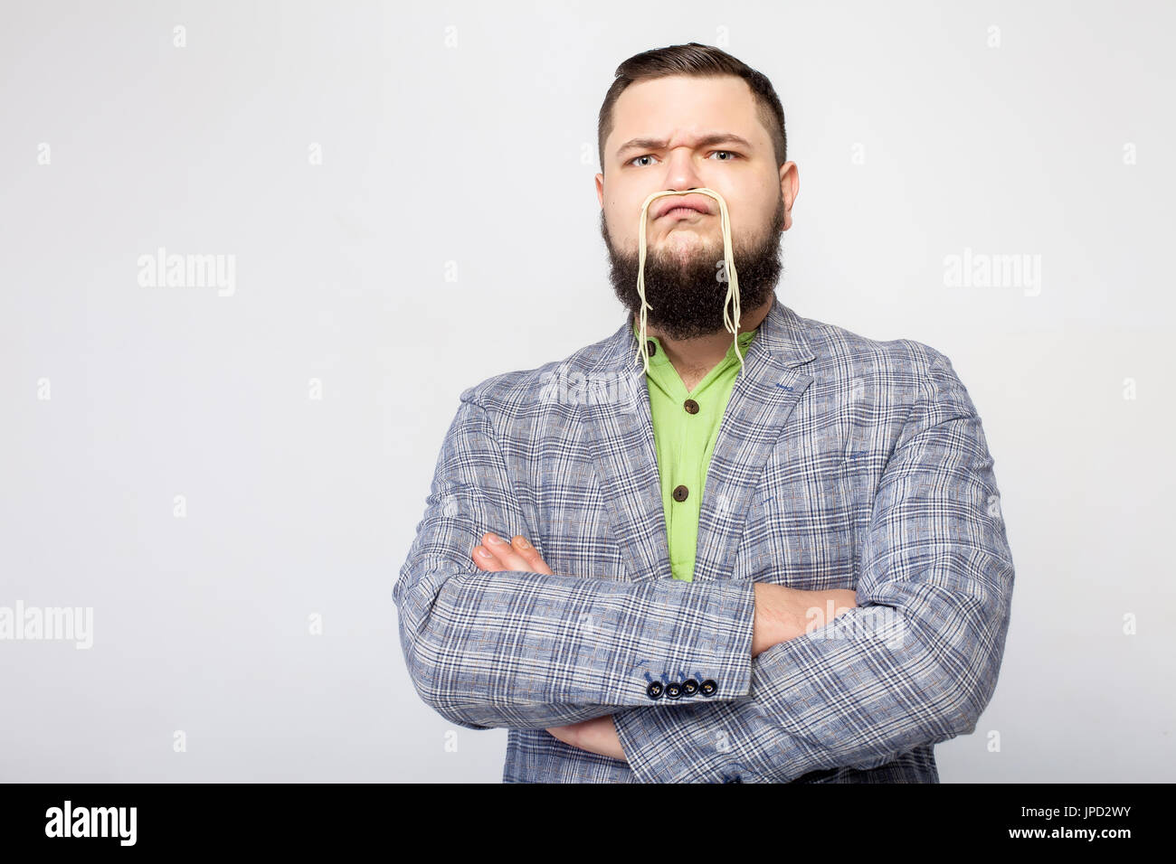 angry fat man with pasta Stock Photo