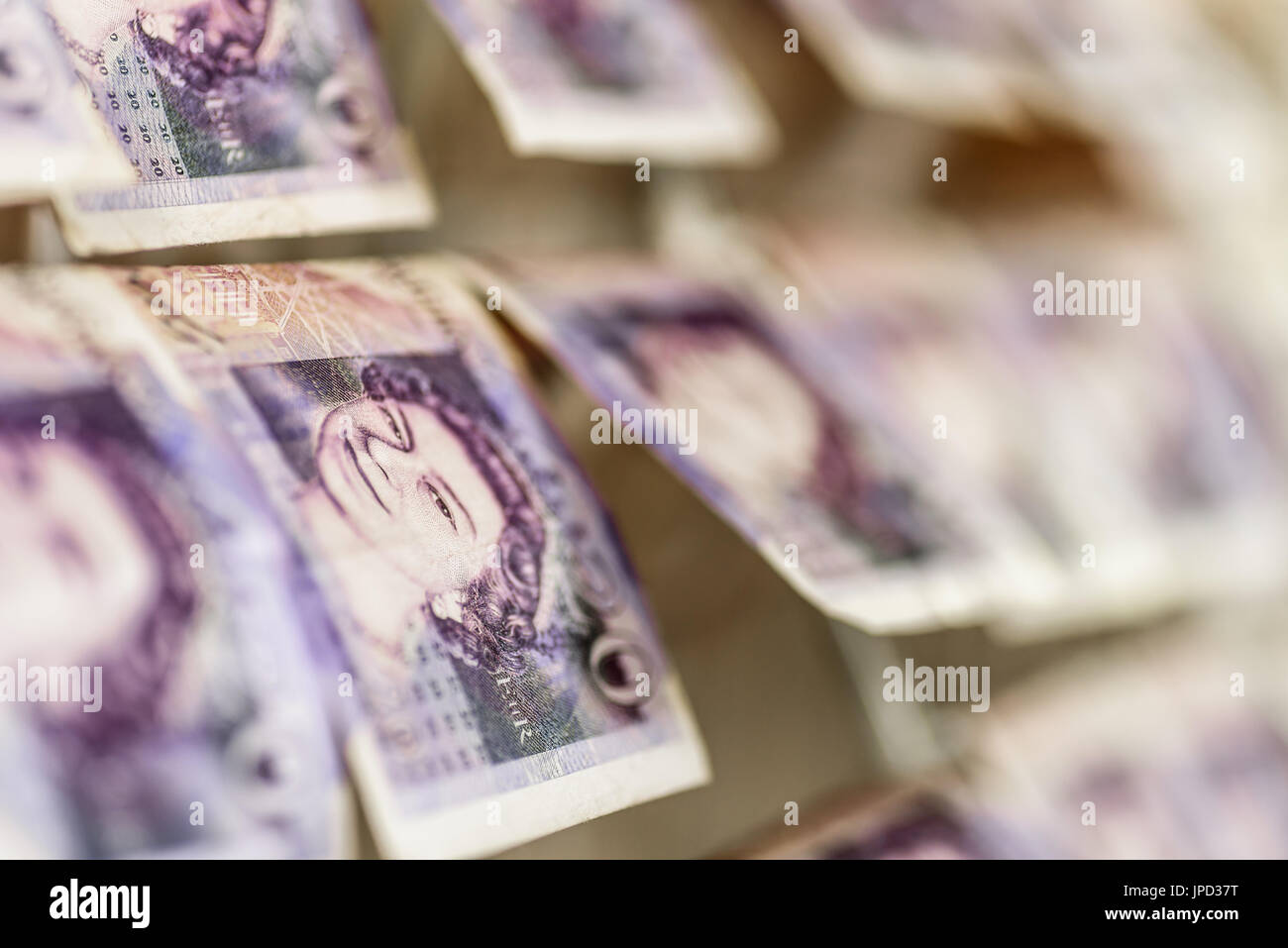 British Sterling Pounds Notes On Clothes Dryer. Money Laundering Concept. Stock Photo