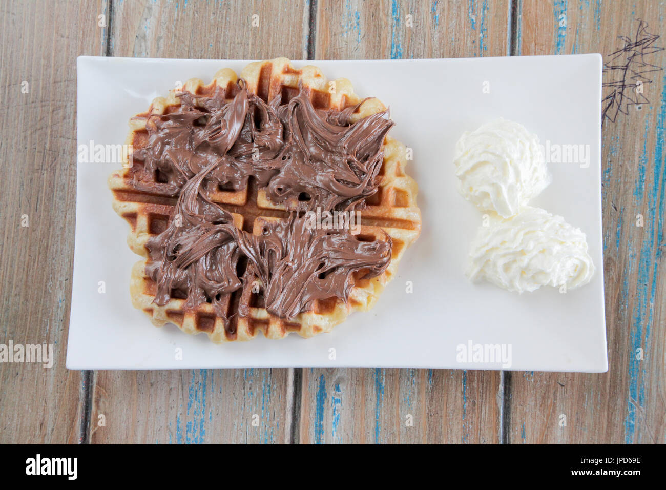 Nutella waffle with whipped cream Stock Photo Alamy