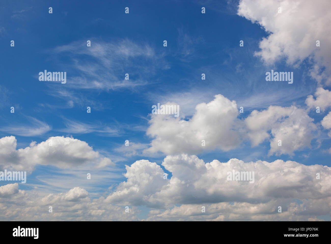 a blue sky background with fluffy white clouds in summer time Stock ...