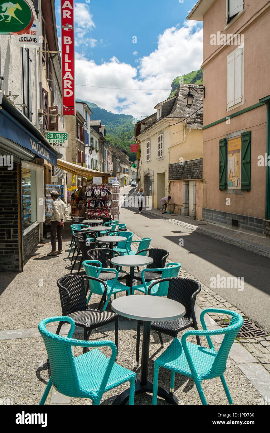 Café terrace, tables and chairs - Laruns, Pyrénées-Atlantiques, France. Stock Photo