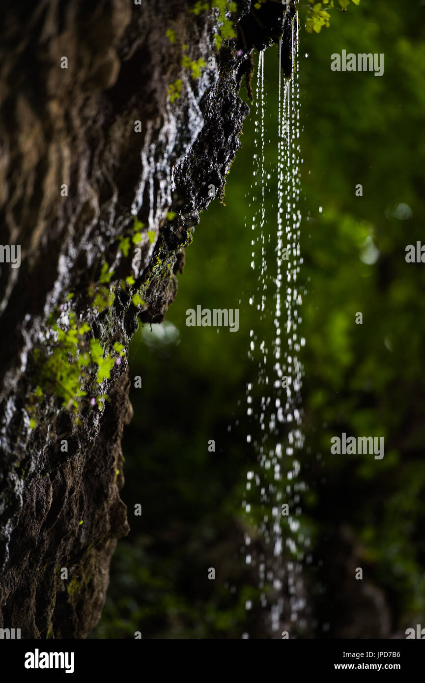 Small waterfall dripping down Stock Photo