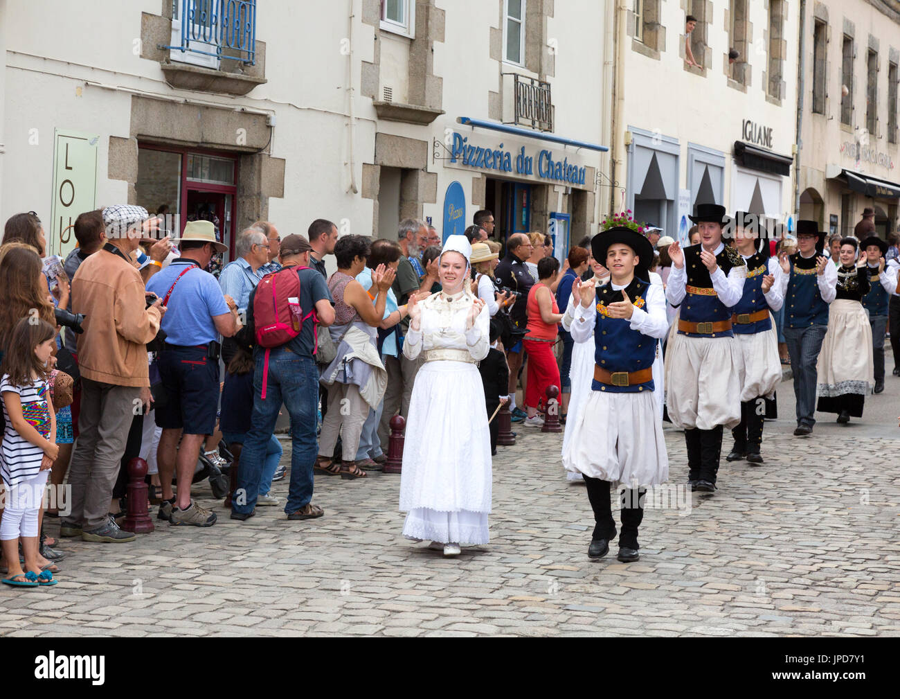 Brittany France - adults in traditional costume parading in the streets of Pont l'Abbe for the Fete des Brodeuses, Brittany France Europe Stock Photo
