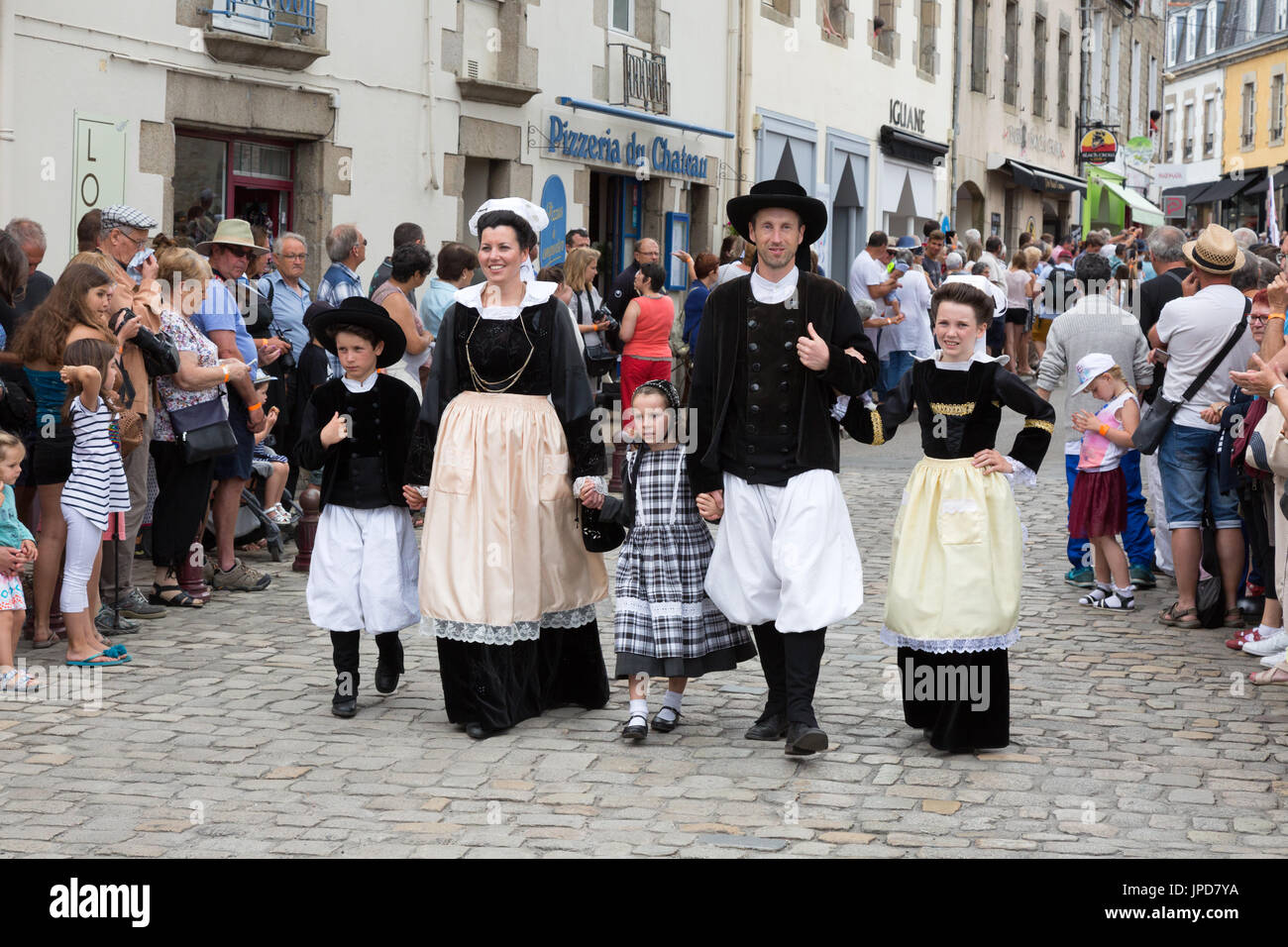 Brittany France - family in traditional costume parading in the streets of Pont l'Abbe for the Fete des Brodeuses, Brittany France Europe Stock Photo