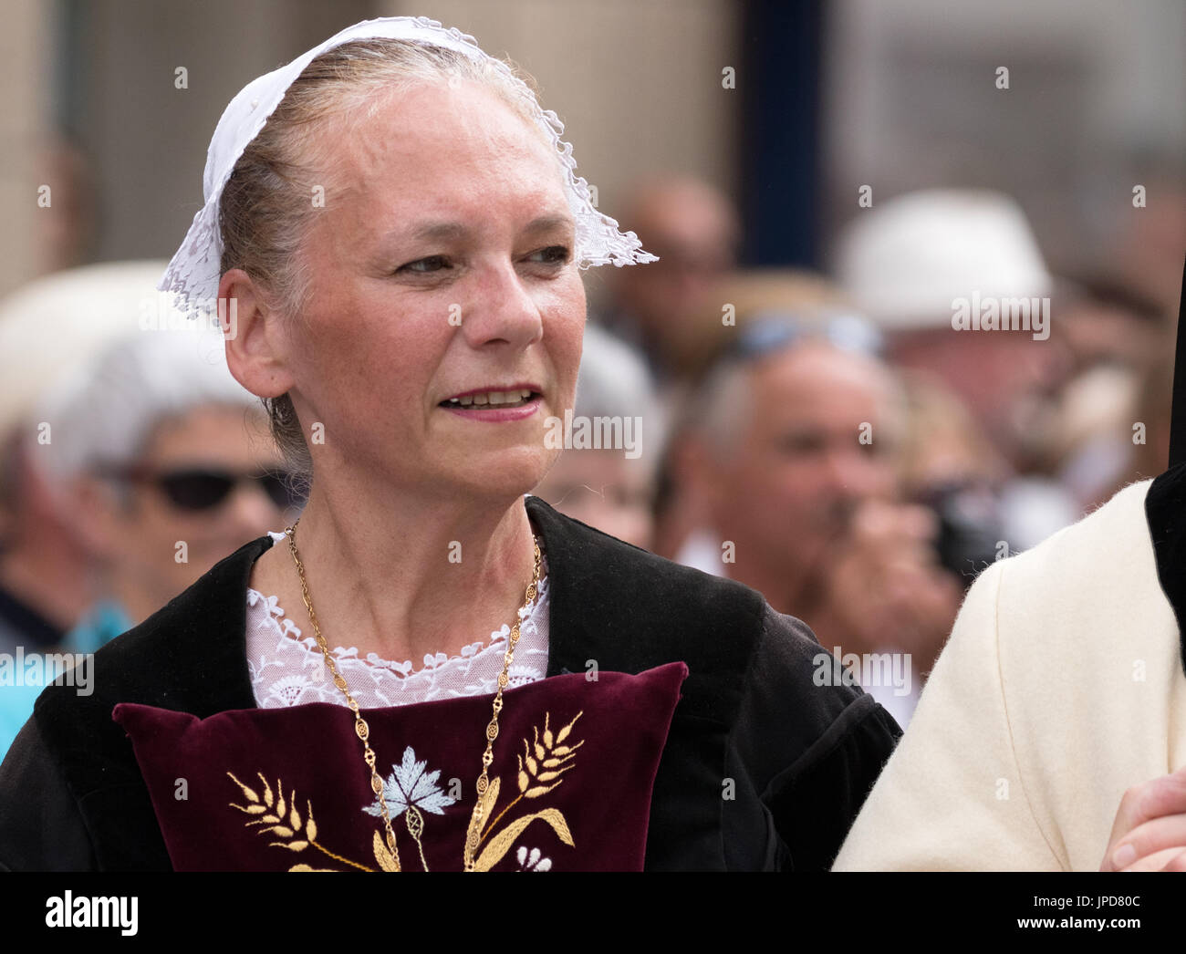 A senior lady dressed in traditional costume in a parade for the Fete des Bordeuses, Pont L'Abbe, Bigouden, Finistere, Brittany France Europe Stock Photo