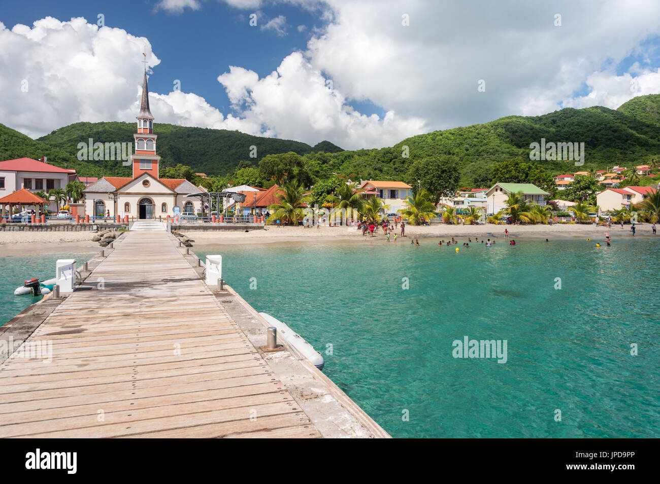 Petite Anse d'Arlet village, with Saint Henri Church and pontoon, in Martinique Stock Photo