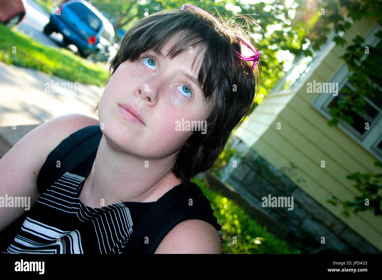 pretty girl with bright eyes looking up Stock Photo Alamy