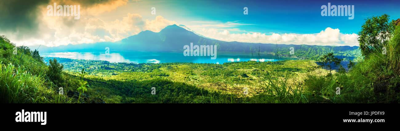 Panoramic nature landscape tropical island bali. Popular tourist attractions of tropical island Bali, amazing top view volcano Mount Batur, Indonesia Stock Photo