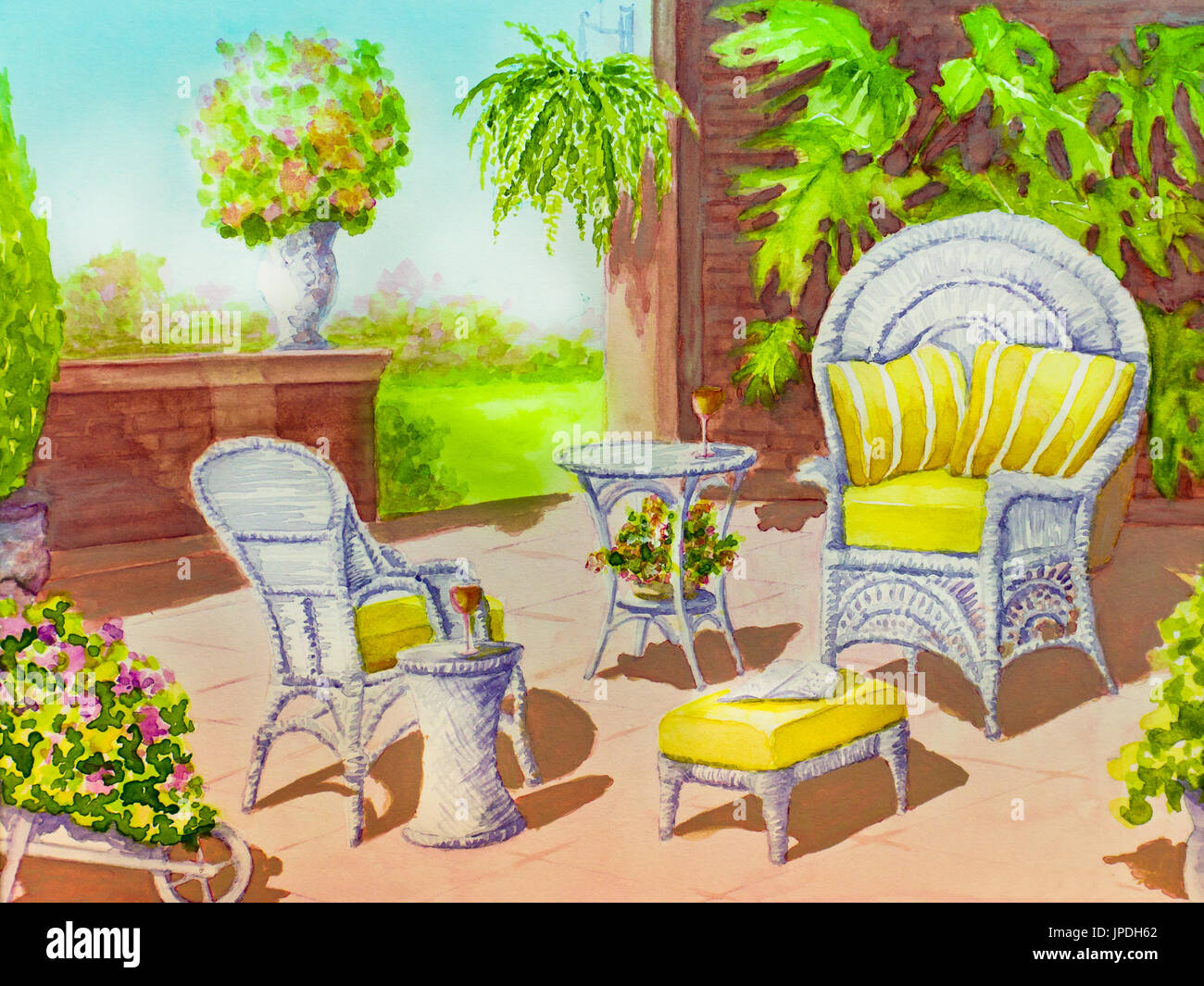 White wicker chairs tables and a footstool are surrounded by greenery