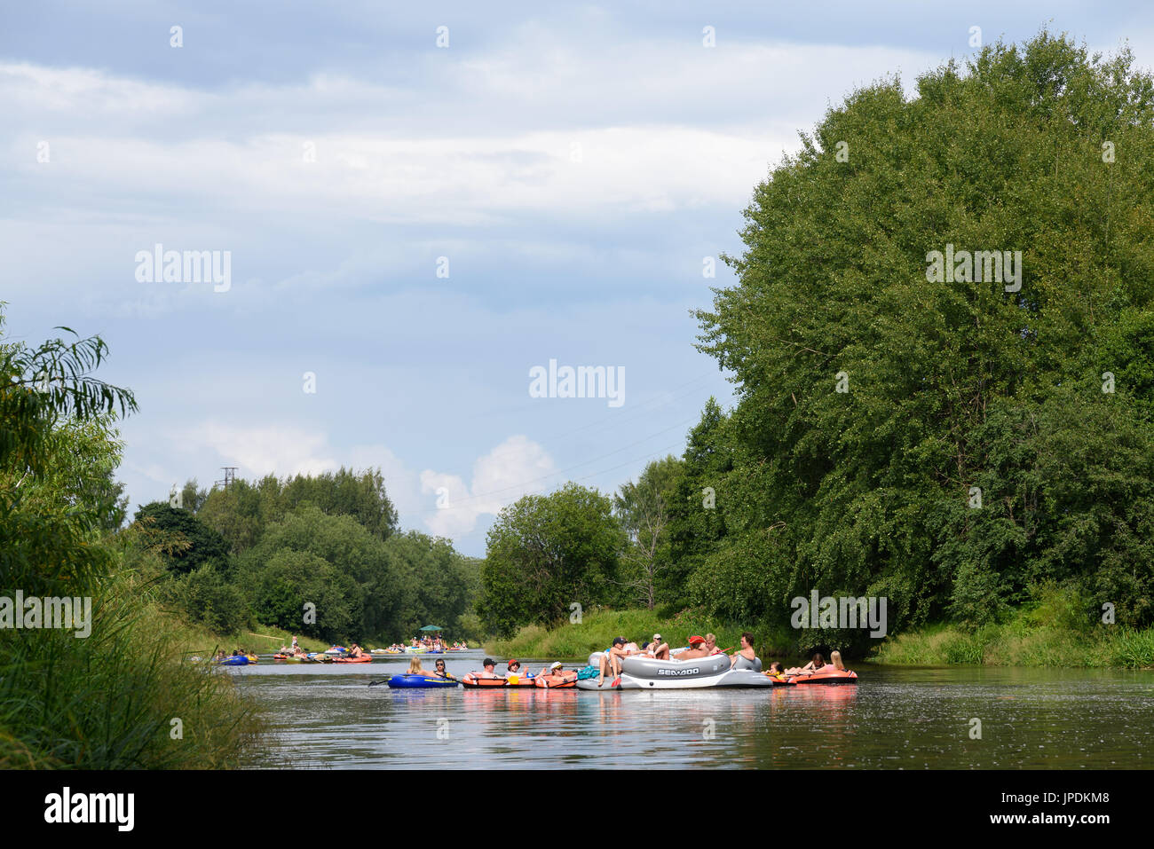 Helsinki, Finland – July 30, 2016: Unidentified people drafting and tubing in Vantaanjoki river on rubber dinghies, rafts and other inflatable floatin Stock Photo