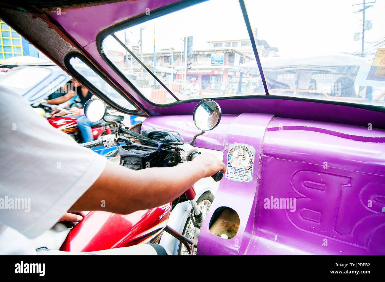 Inerior of tricycle taxi with driver, Puerto Princesa, Palawan, Philippines Stock Photo