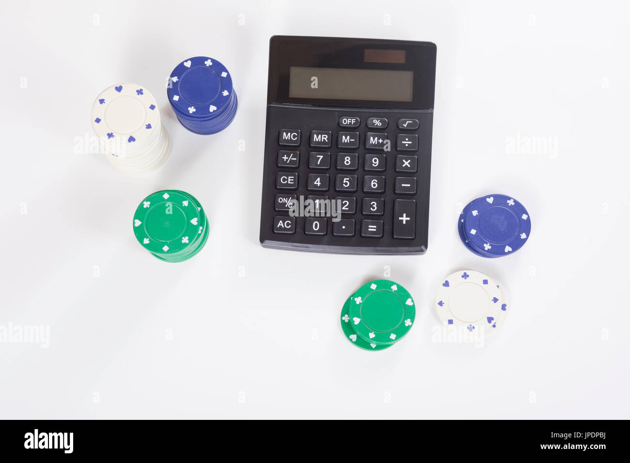Top down view on calculator surrounded by assorted white, blue and