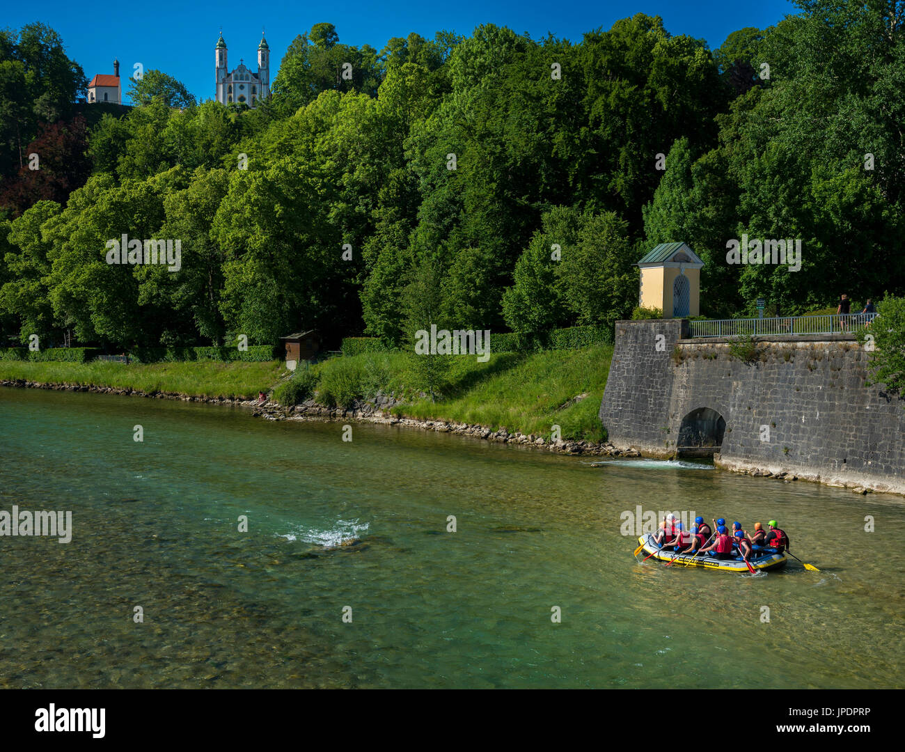 Rafting on the river Isar, at back Church of the Holy Cross, Bad Tölz, Bavaria, Germany Stock Photo